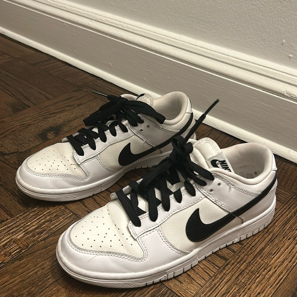 Women's black and white nike sneakers.